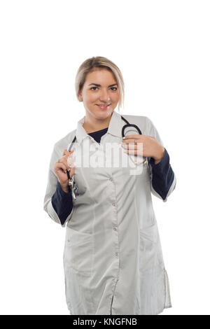 a young doctor, folded his hands, in a doctor`s overall Stock Photo